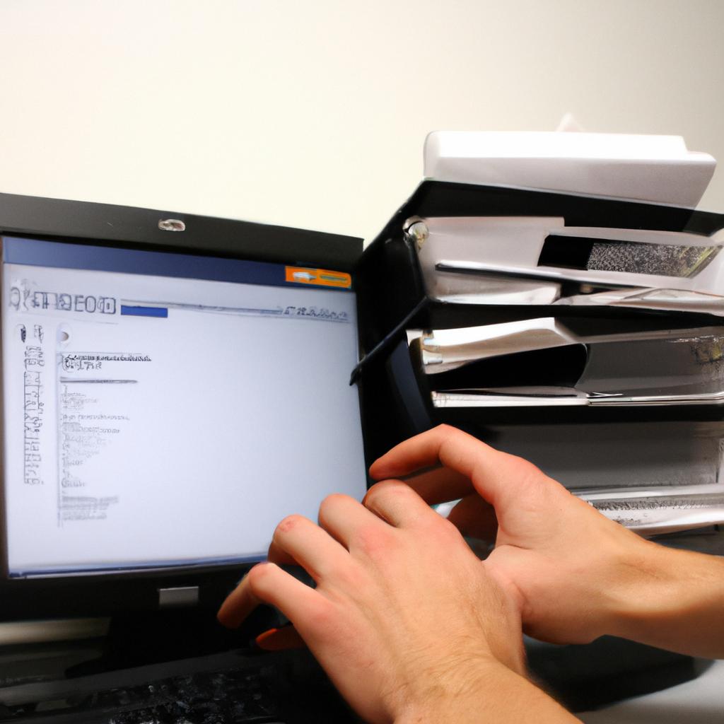 Person organizing files on computer