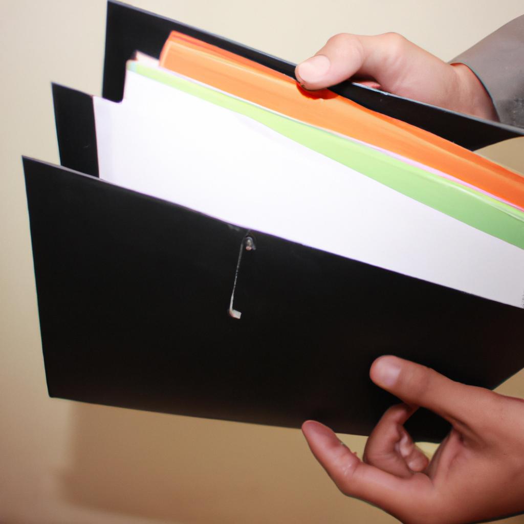 Person holding open file folder