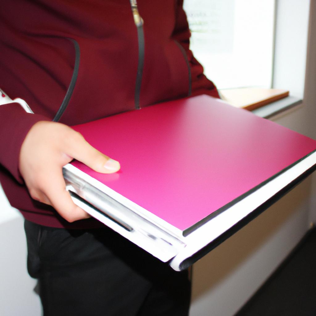 Person holding a folder, organizing